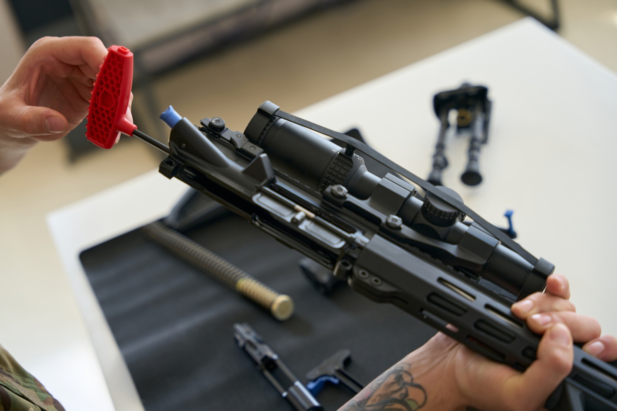 Tool for cleaning firearms in male hands