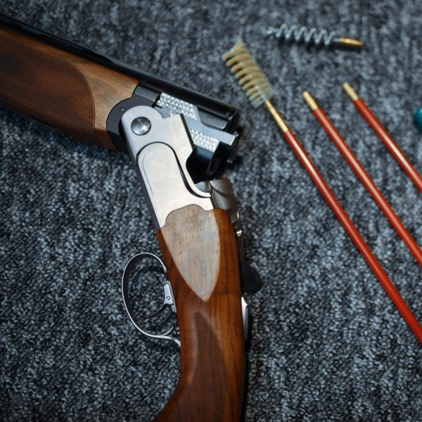 Rifle, ammo and tools for cleaning in gun shop